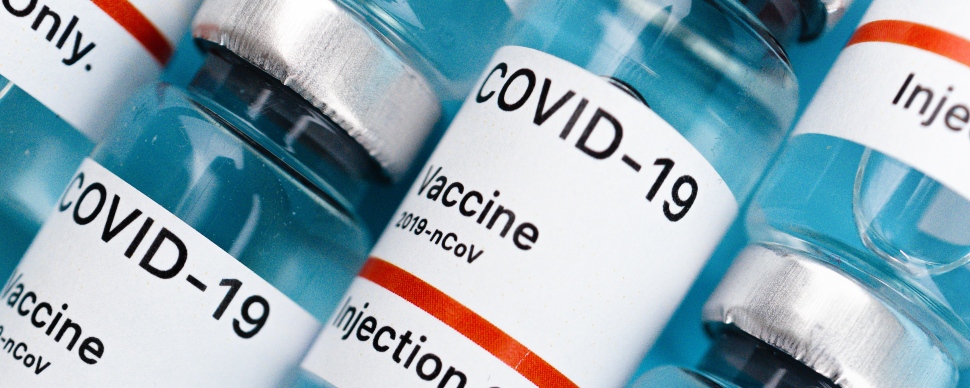 Bottles of COVID-19 vaccines