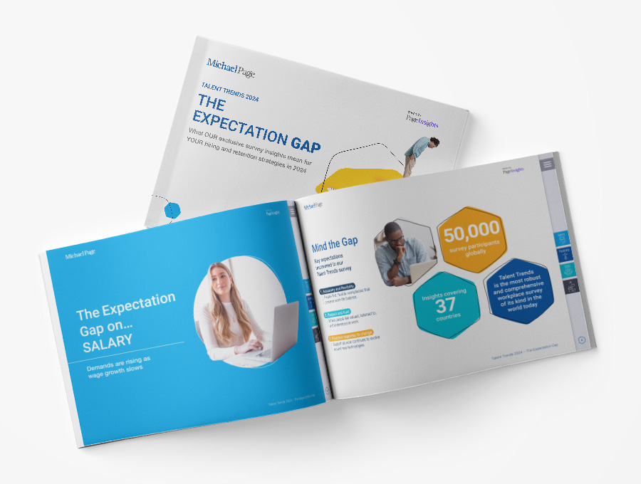 Open book showing pages about salary expectation gaps and survey insights.