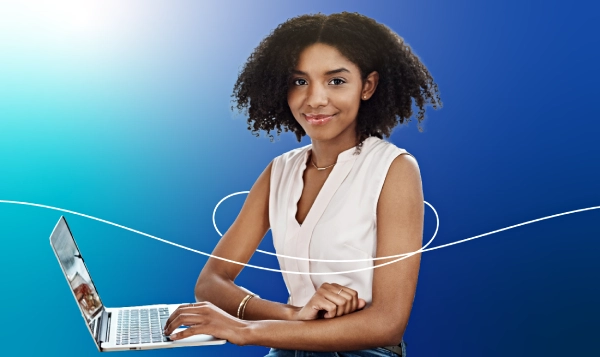 A lady holding a laptop with a gradient blue background.