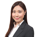 Portrait of a woman smiling in a business suit.