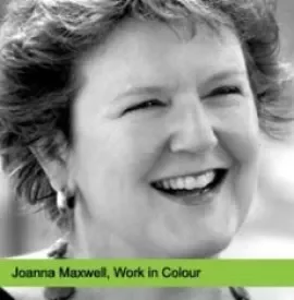 Black and white photo of a woman smiling.