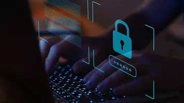 Hands typing on a keyboard with a digital lock and password symbol overlay.