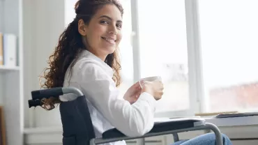 lady-on-wheelchair-near-laptop