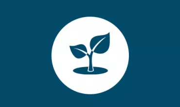 Icon of a small plant with two leaves inside a circle.