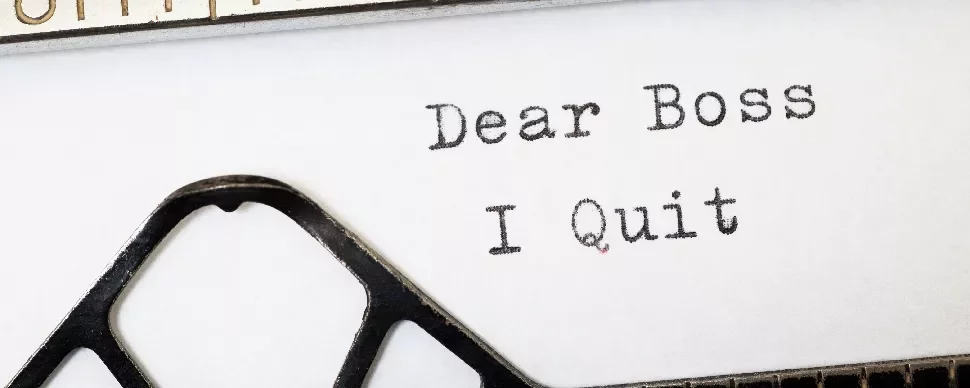 Typewriter with 'Dear Boss I Quit' typed on paper.
