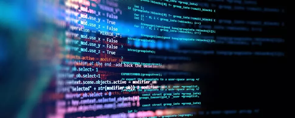 Close-up of colorful computer code lines on a black screen.