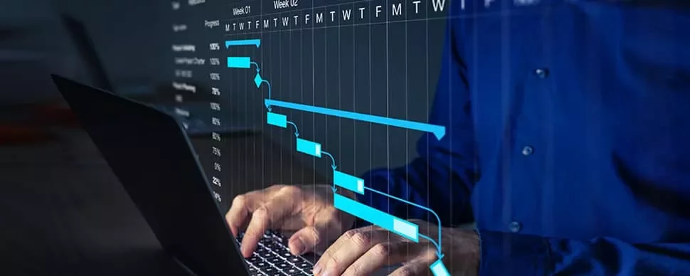 Person using a laptop with a visible project timeline chart on screen.