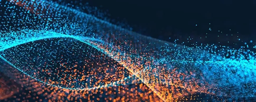 Abstract image of blue and orange particles forming wave-like patterns.