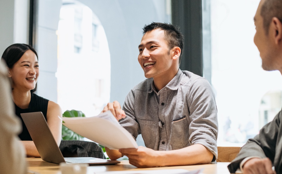 Man-smiling-looking-at-paper